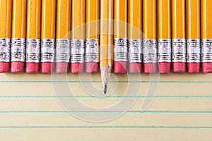 Yellow Pencils & Erasers on Paper photo