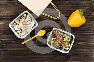 Yellow pepper and spoon lying on the table