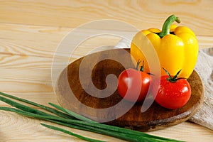 Yellow pepper tomatoes cutting board kitchen