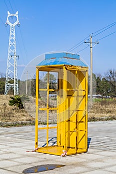 Yellow phone booth in the park