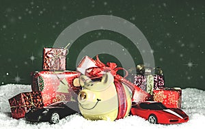 Yellow pig with a red bow, miniature cars, presents