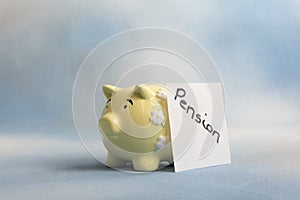 Yellow piggy bank money box with pesion