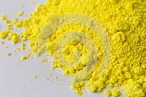 Yellow pigment on a white background