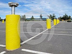 Yellow pillars with electrical plugs to connect the cars to heat up the engine and oil in extreme winter conditions in