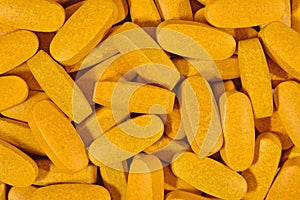 Yellow pills background