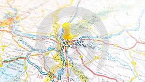 A yellow pin stuck in Bratislava on a map of Slovakia