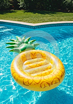 Yellow Pineapple Inflatable Pool Float in a Blue Pool