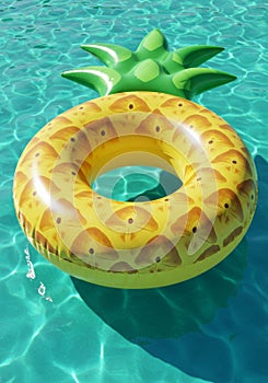 Yellow Pineapple Inflatable Pool Float in Turquoise Water