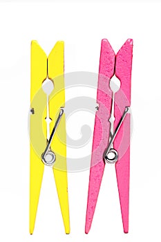 Yellow and pink clothes pegs