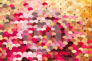 Yellow and pink colored Christmas sparkles as an abstract holiday background