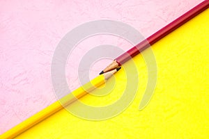 the Yellow and pink pencil on paper background ,creative innova