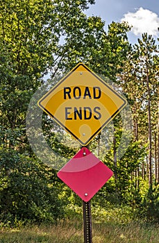 Yellow and Pink Signs for the End of the Road