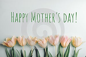 Yellow-pink tulips on light green background with words Happy Mother's day