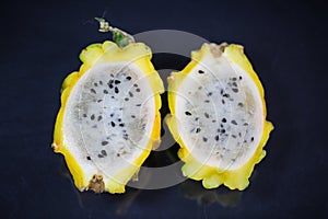 Yellow pitahaya on black background