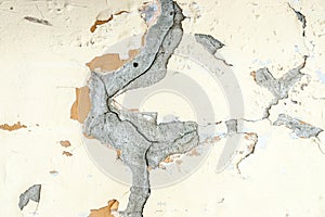 Yellow plaster wheathered wall texture with cracks