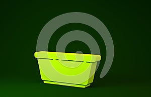 Yellow Plastic basin icon isolated on green background. Bowl with water. Washing clothes, cleaning equipment. Minimalism