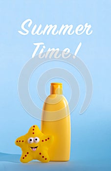 Yellow plastic bottle with baby cosmetic and funny toy. Sunscreen lotion. The concept of children's sun protection
