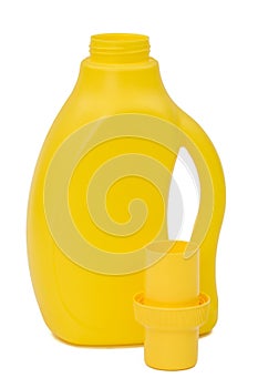 Yellow plastic bottle with a dispenser in cap, isolated on white