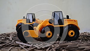 Yellow plastic bulldozer toy10