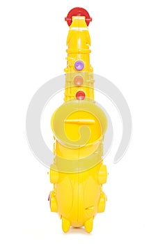Yellow plastic childs saxophone toy