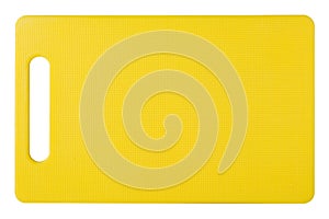 Yellow plastic cutting board, new board, top view, white background