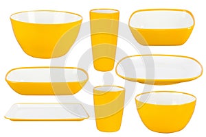 Yellow plastic dishes on white background