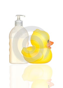 Yellow plastic duck and boat bath dispenser isolat