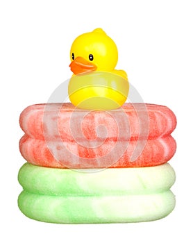 Yellow plastic duck over sponges