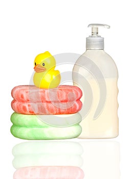 Yellow plastic duck over sponges and boat bath dis