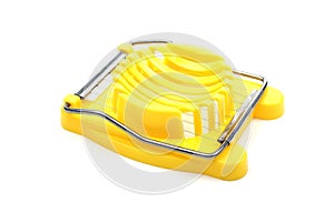 Yellow plastic egg cutter.