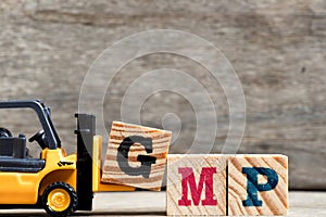Yellow plastic forklift hold letter G to complete GMP
