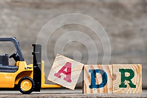 Yellow plastic forklift hold letter A to complete ADR photo