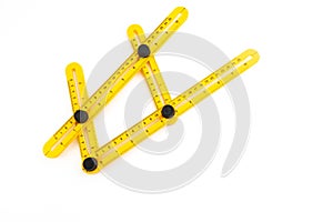 Yellow plastic measurement degree ruler isolated