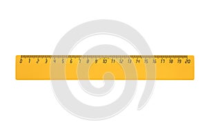 Yellow plastic ruler 20 centimeters long is isolated on a white background photo