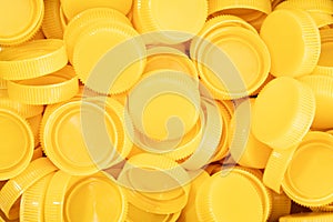 Yellow plastic screw caps background