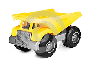 Yellow plastic toy mining tipper dumper truck, isolated