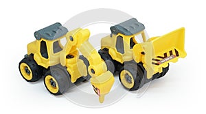 yellow plastic toy of tractor drill and bulldozer or loader isolated on white background.