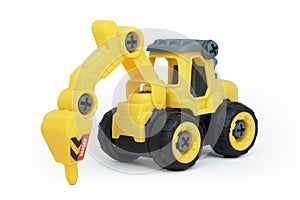 yellow plastic tractor drill toy isolated on white background.