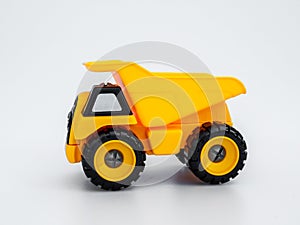 Yellow plastic truck  toy isolated white