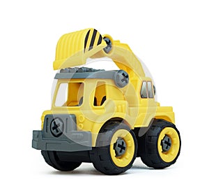 Yellow plastic truck toy isolated on white background.