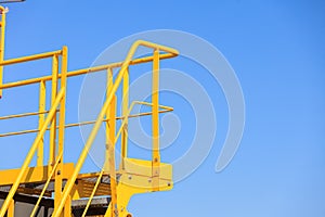 Yellow platform with steps, industry detail
