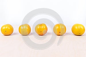 Yellow plum fruit on the white background
