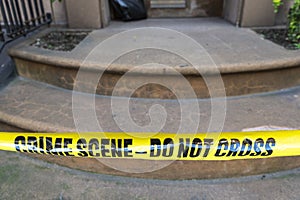Yellow police tape with the text: crime scene do not cross