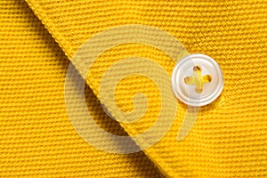 Yellow polo shirt texture, cotton fabric. Textile background