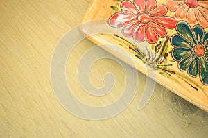 yellow porcelain tablemat on a pastel green background