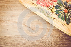 yellow porcelain tablemat on a pastel green wood surface