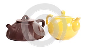 Yellow porcelain teapot and yixing clay teapot