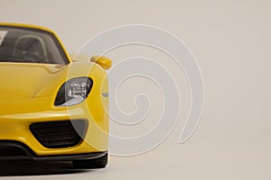 Yellow Porsche 918 Spyder model car front view half car