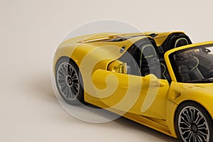 Yellow Porsche 918 Spyder model car side view open door photo