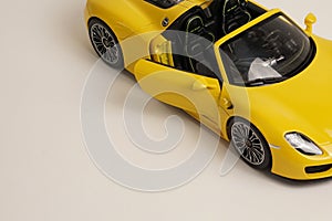 Yellow Porsche 918 Spyder model car top side view photo